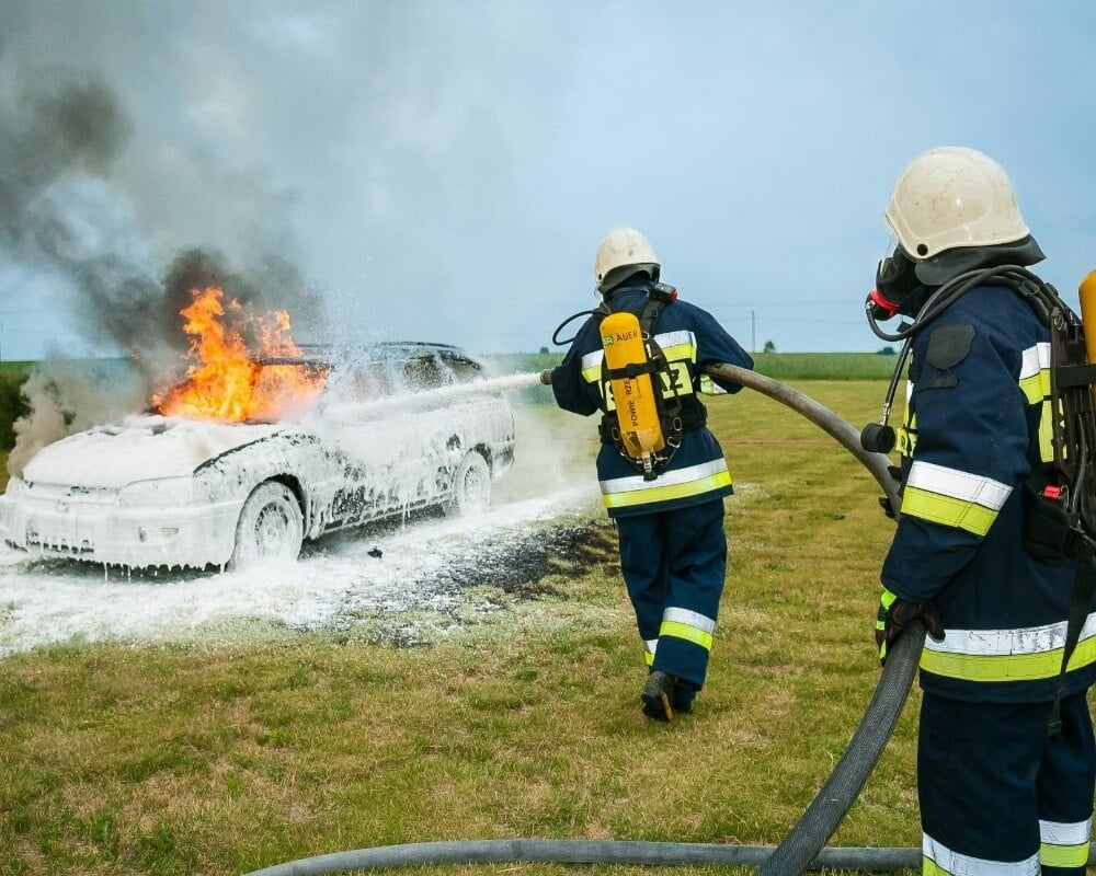 Employee using a fire extinguisher on a live fire during CPR1 fire extinguisher training