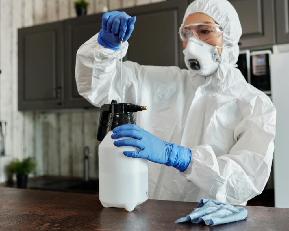 Instructor demonstrating glove removal and PPE during a CPR1 OSHA bloodborne pathogens class